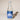 Bottle of Birch Brew, the fermented birch beverage, on a beige background