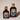 Two bottles of 'Reserve' alaska pure birch syrup on a beige background