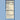A vertical Nutrition Facts label for a beverage bottle of original fermented birch water, shown centered on a solid light blue background. The label is dark navy with cream and beige sections and reads 'Nutrition Facts' at the top.