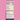 A Nutrition Facts label for a fermented raspberry birch water soda, showing 0g nutrients per serving on a white background with purple text, set against a solid pink backdrop.